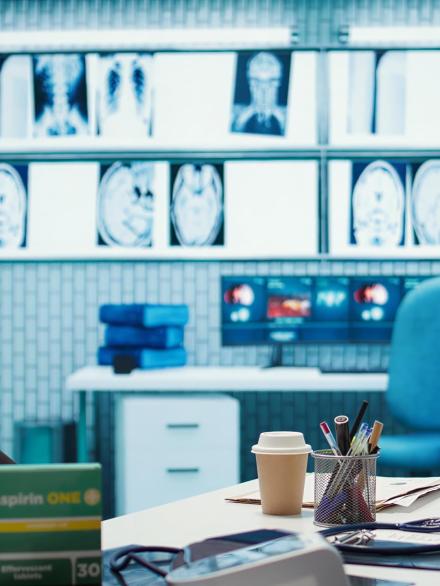 Empty doctor office featuring modern medical equipment and pills, ready for the next patient consultation. Highlighting advanced diagnostics, healthcare services and patient care management.